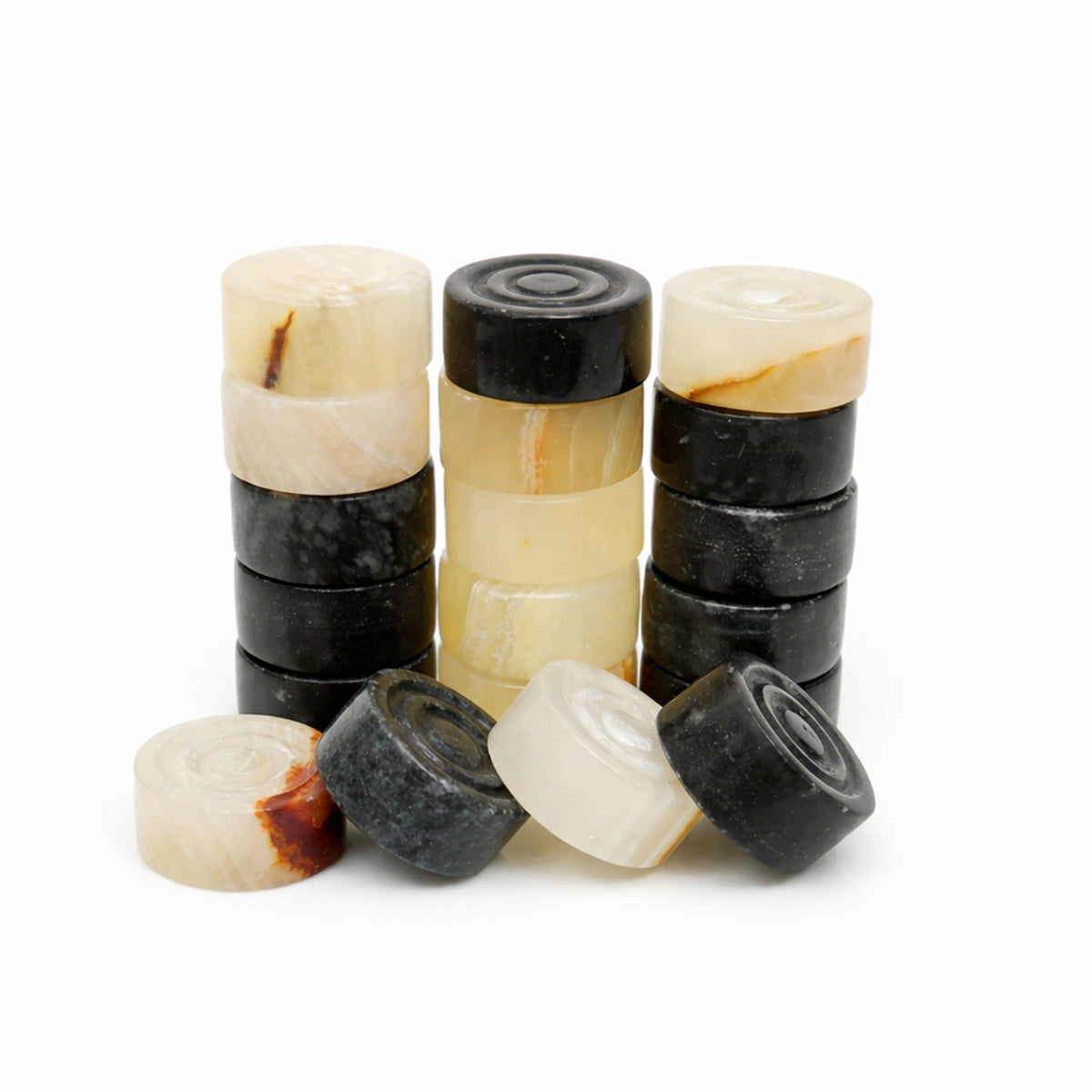 Foundly black and white onyx marble checkers set with hand-carved stone pieces in a stack and scattered arrangement