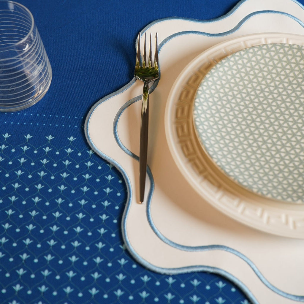HAVEN WHITE WAVY EDGE BLUE TRIM FAUX LEATHER PLACEMAT (Set Of 4)